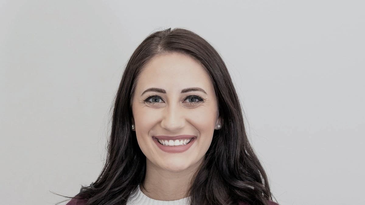 A smiling real estate agent